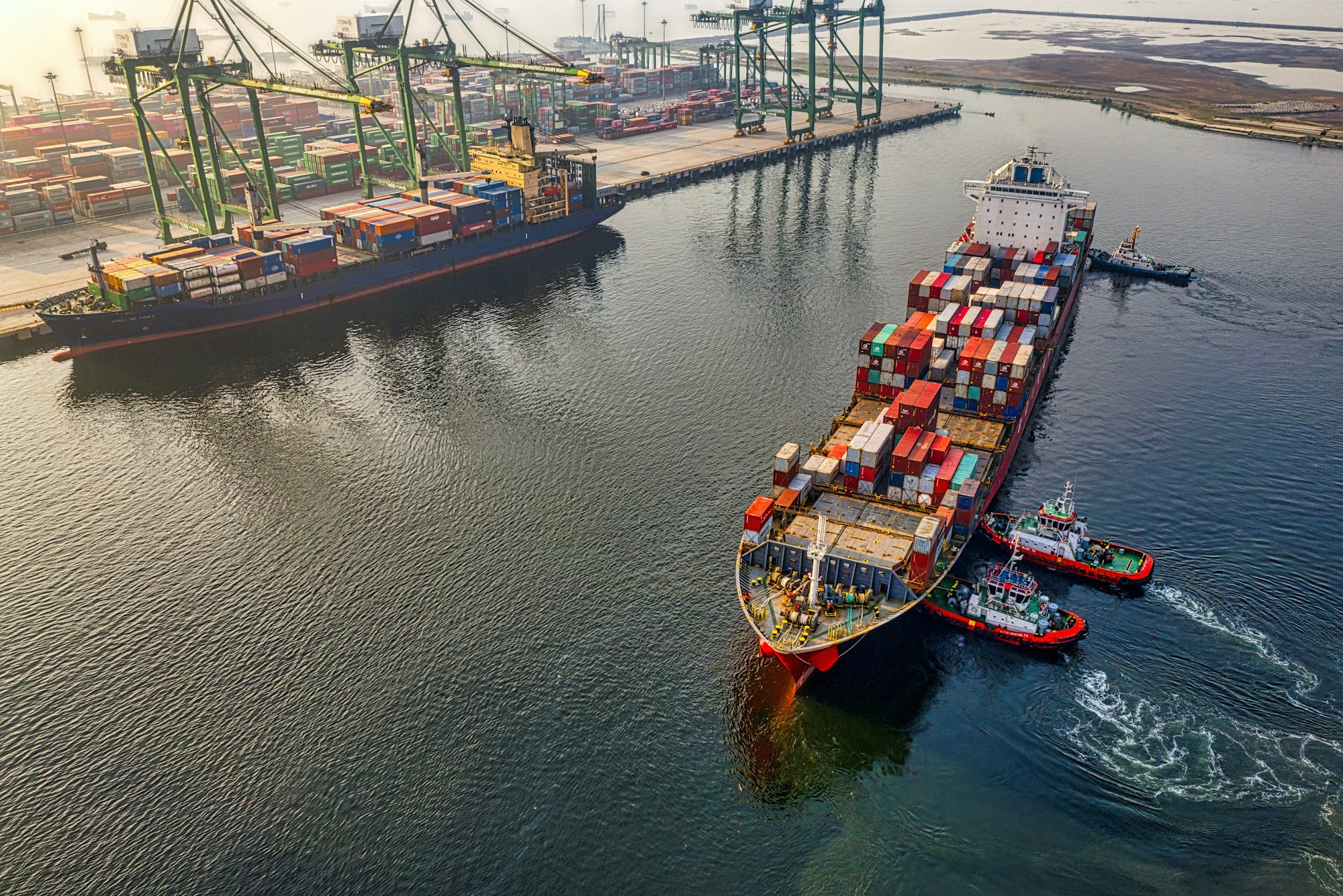 Container vessel under tug at a Los Angeles container terminal